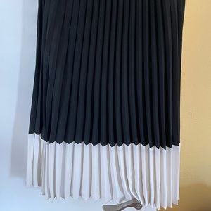Pleated black and white midi skirt